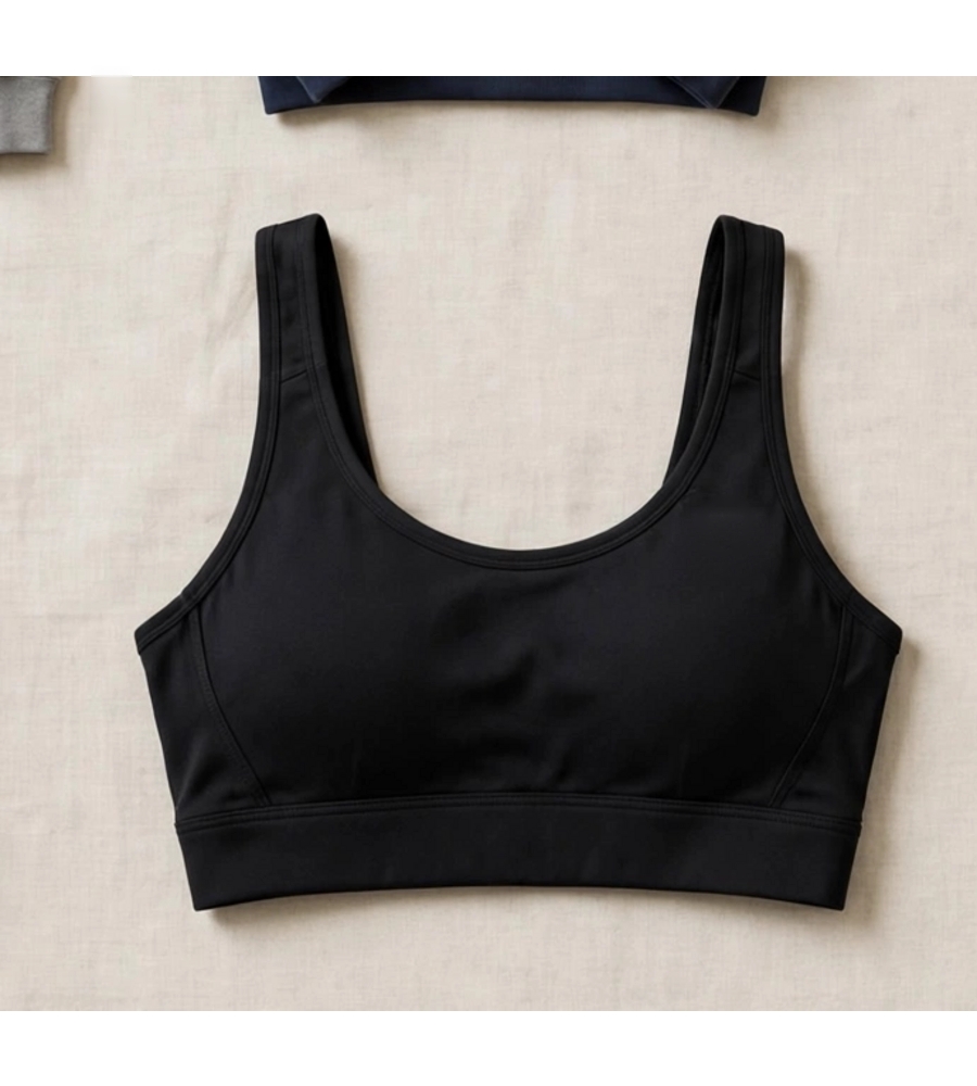 Black cropped yoga sport bra shown with the fused Omega Woman mark and the words UNBOTHERED, UNSTOPPABLE